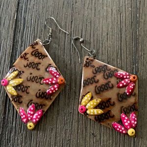 Adorable handmade earrings with flower detail!
